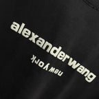Close-up of alexanderwang logo and YUO MU text on a dark black T-shirt