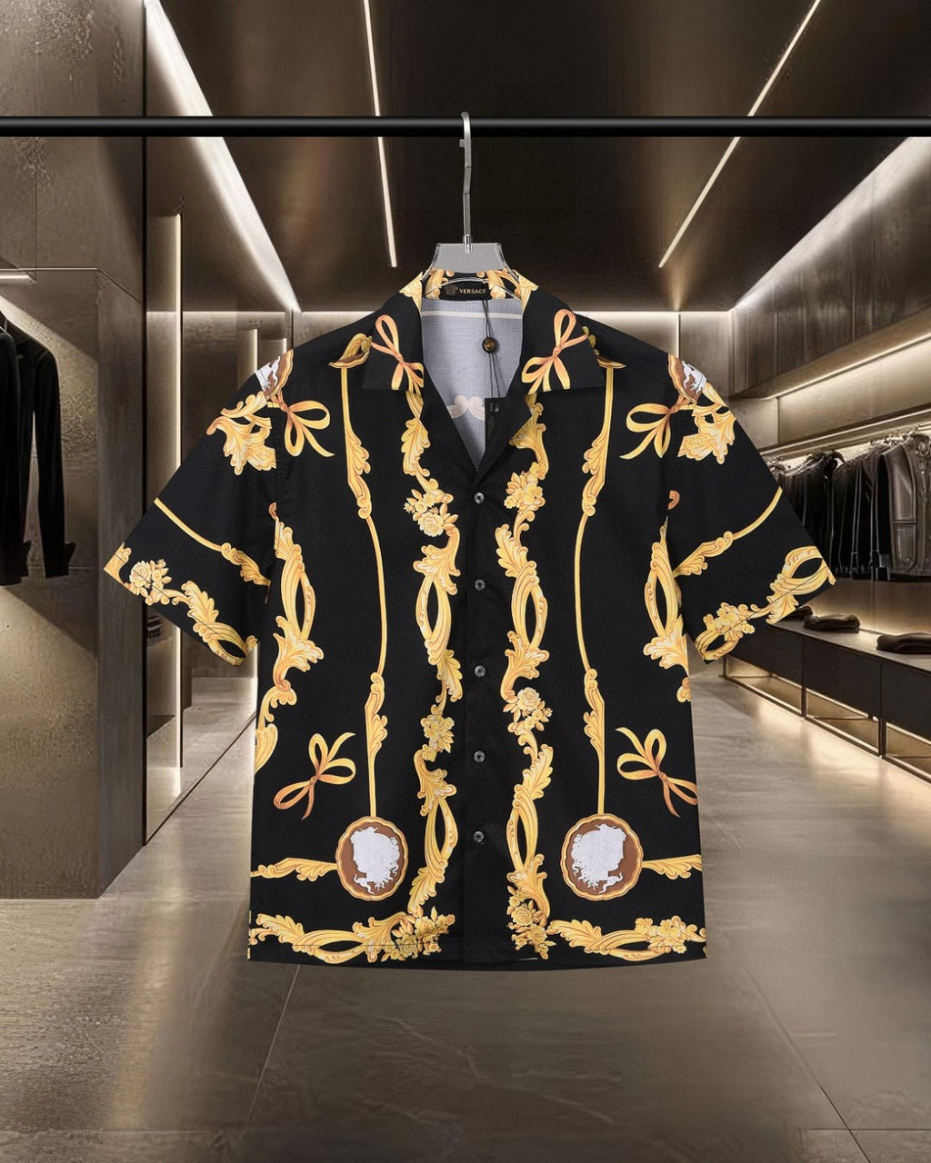 Front view black shirt with gold baroque scrolls and central cameo medallion