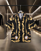 Front view black shirt with gold baroque scrolls and central cameo medallion