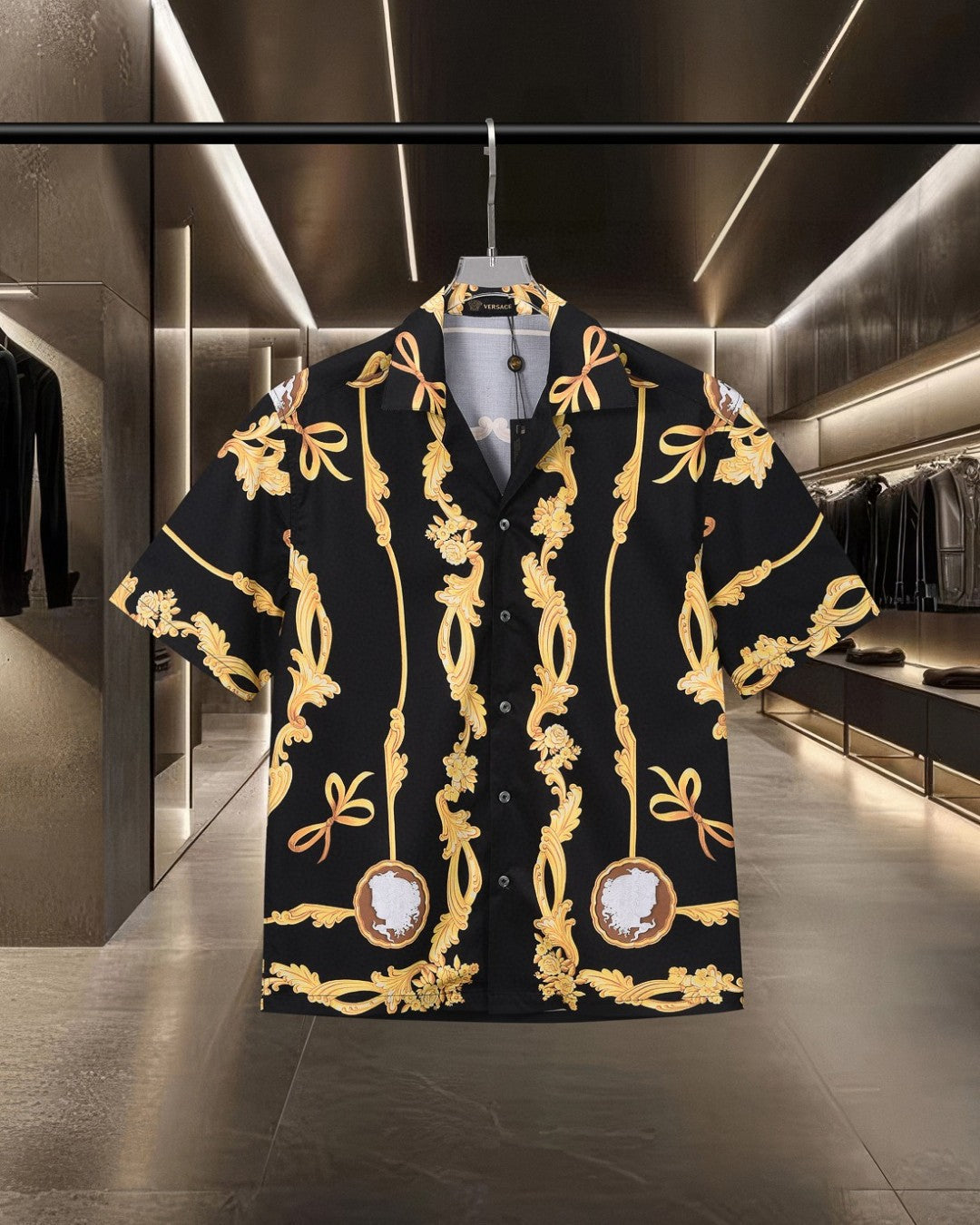 Front view black shirt with gold baroque scrolls and central cameo medallion