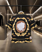 Back view black shirt with oval cameo portrait and gold ornate frame details