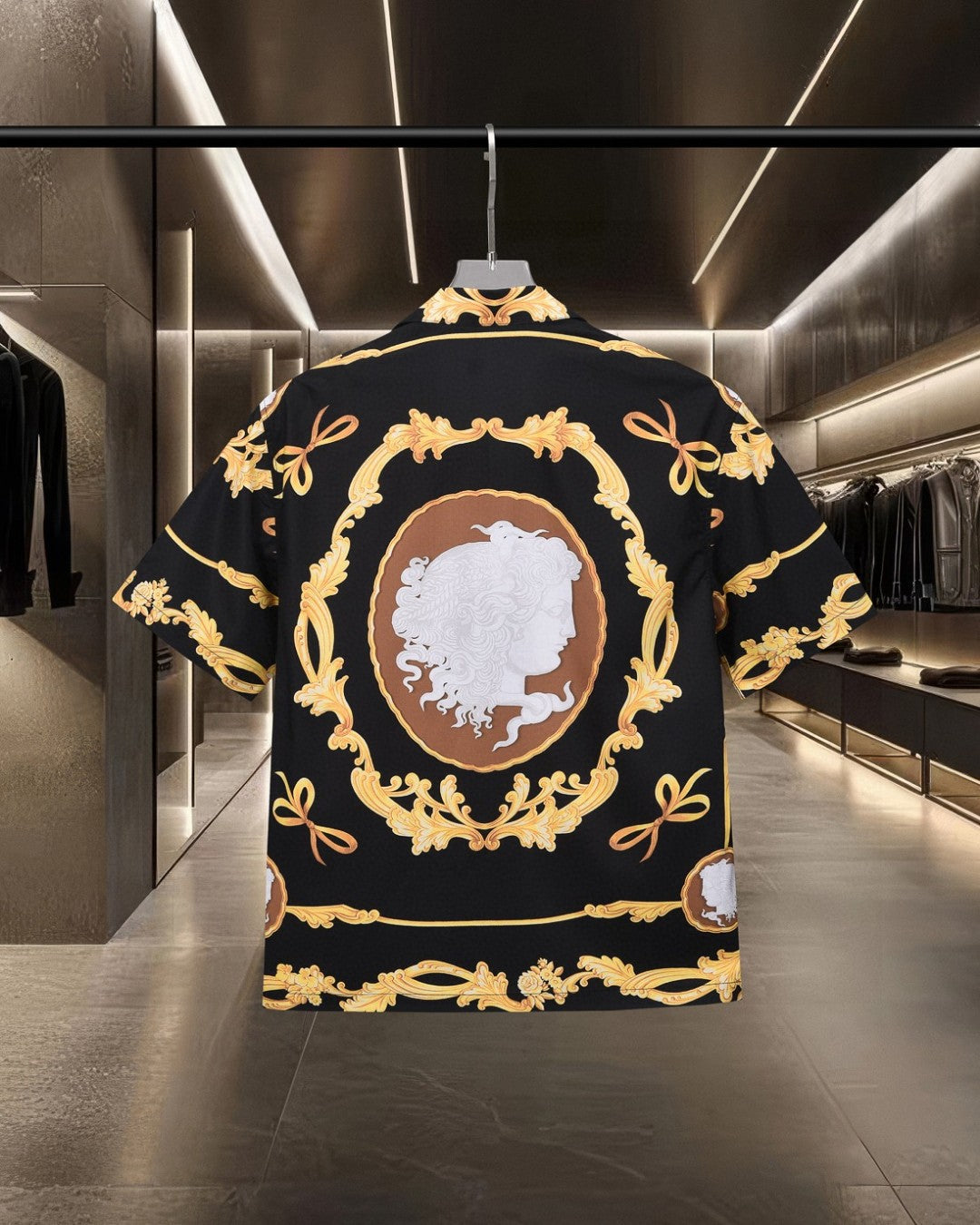 Back view black shirt with oval cameo portrait and gold ornate frame details