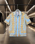 Versace short-sleeve button-up shirt in light blue with gold chain print all over