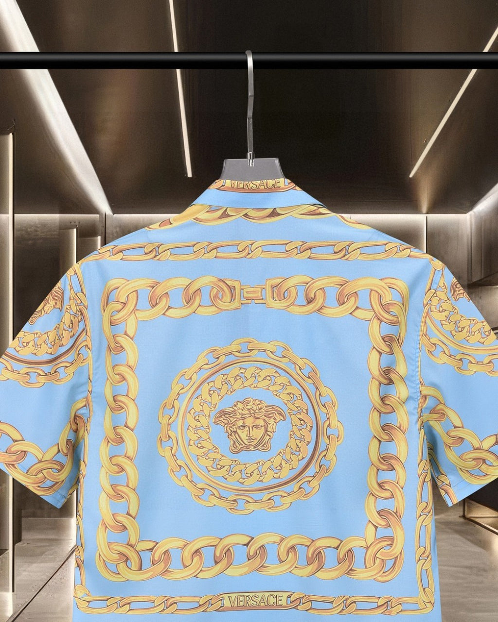 Versace short-sleeve button-up shirt, back close-up, light blue with gold crest ring