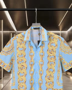Versace short-sleeve button-up shirt front view, light blue with gold chain pattern