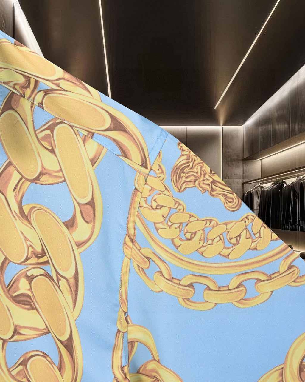 Versace short-sleeve shirt sleeve close-up, light blue with gold chain motif