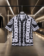 Versace black short-sleeve shirt with white chain link pattern, button front