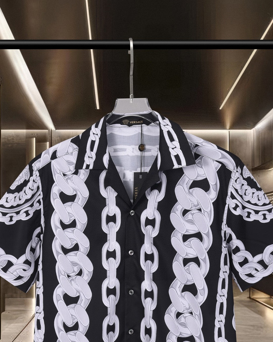 Versace black short-sleeve shirt with white chain print, collared neckline and buttons