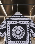 Versace black short-sleeve shirt with white round medallion chain print, button front