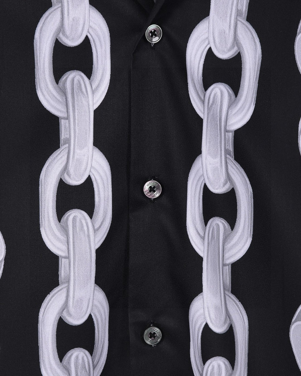 Versace black shirt detail: white chain-link print over button placket