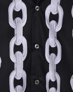 Versace black shirt detail: white chain-link print over button placket