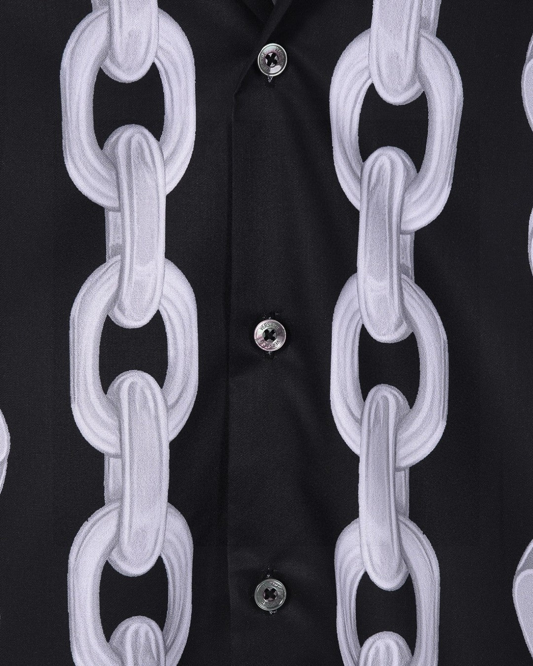 Versace black shirt detail: white chain-link print over button placket