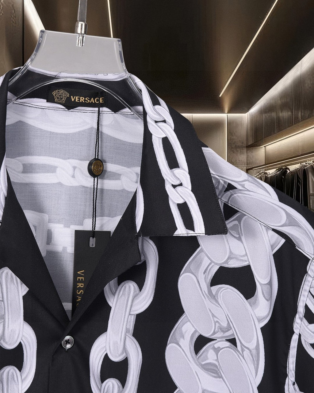 Versace black short-sleeve shirt with white chain print, draped panel detail and buttons