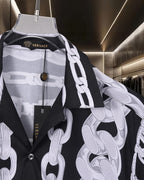 Versace black short-sleeve shirt with white chain print, draped panel detail and buttons