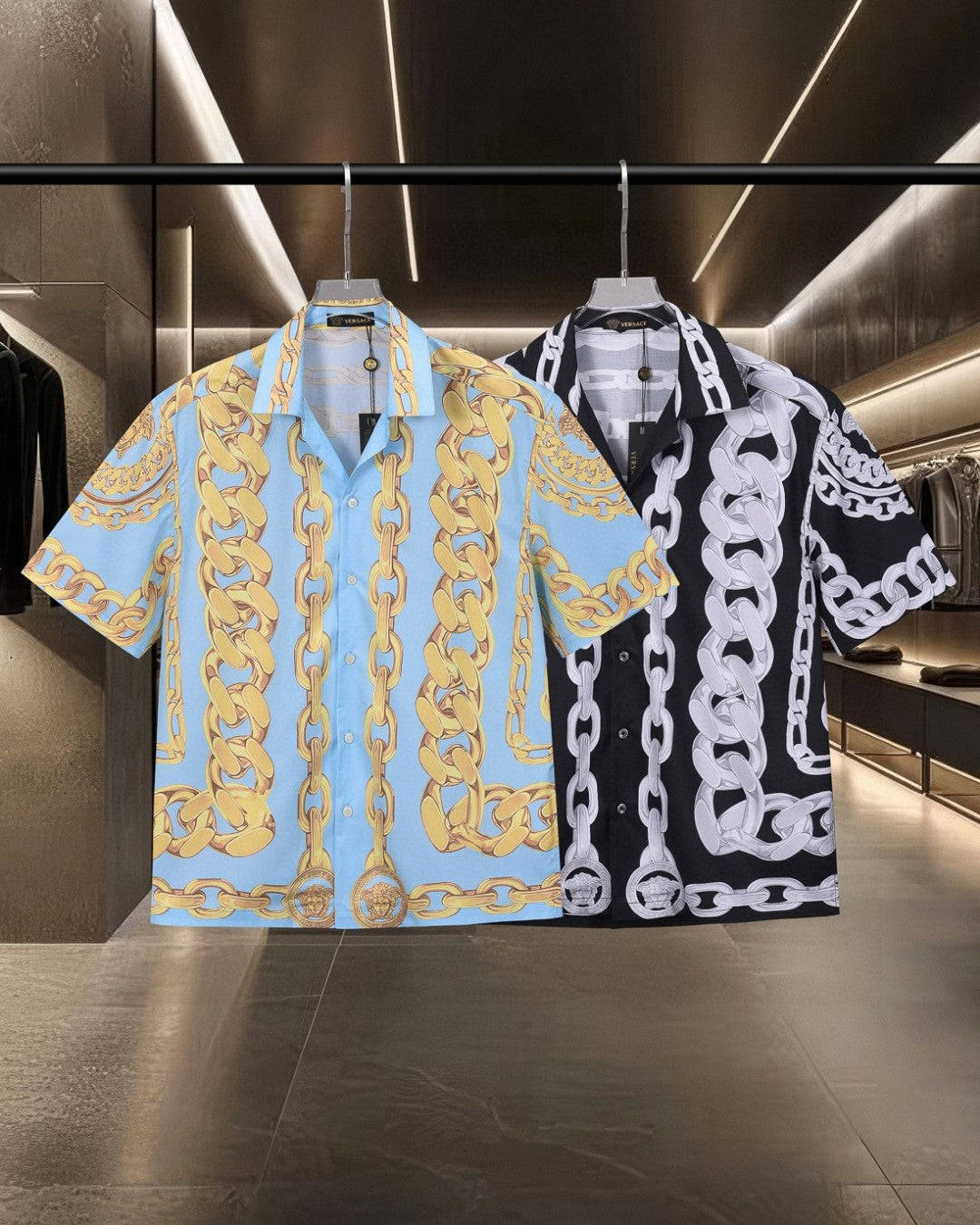 Two short-sleeve shirts: blue gold and black white chain-link prints