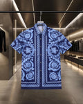 Blue short-sleeve shirt with baroque medallion print and button placket