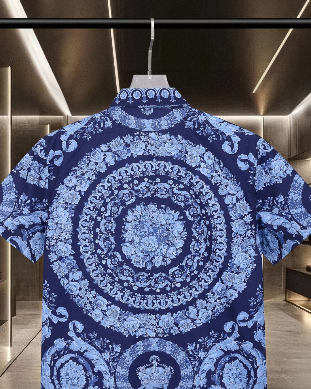 Blue short-sleeve shirt back with large circular medallion and floral motifs