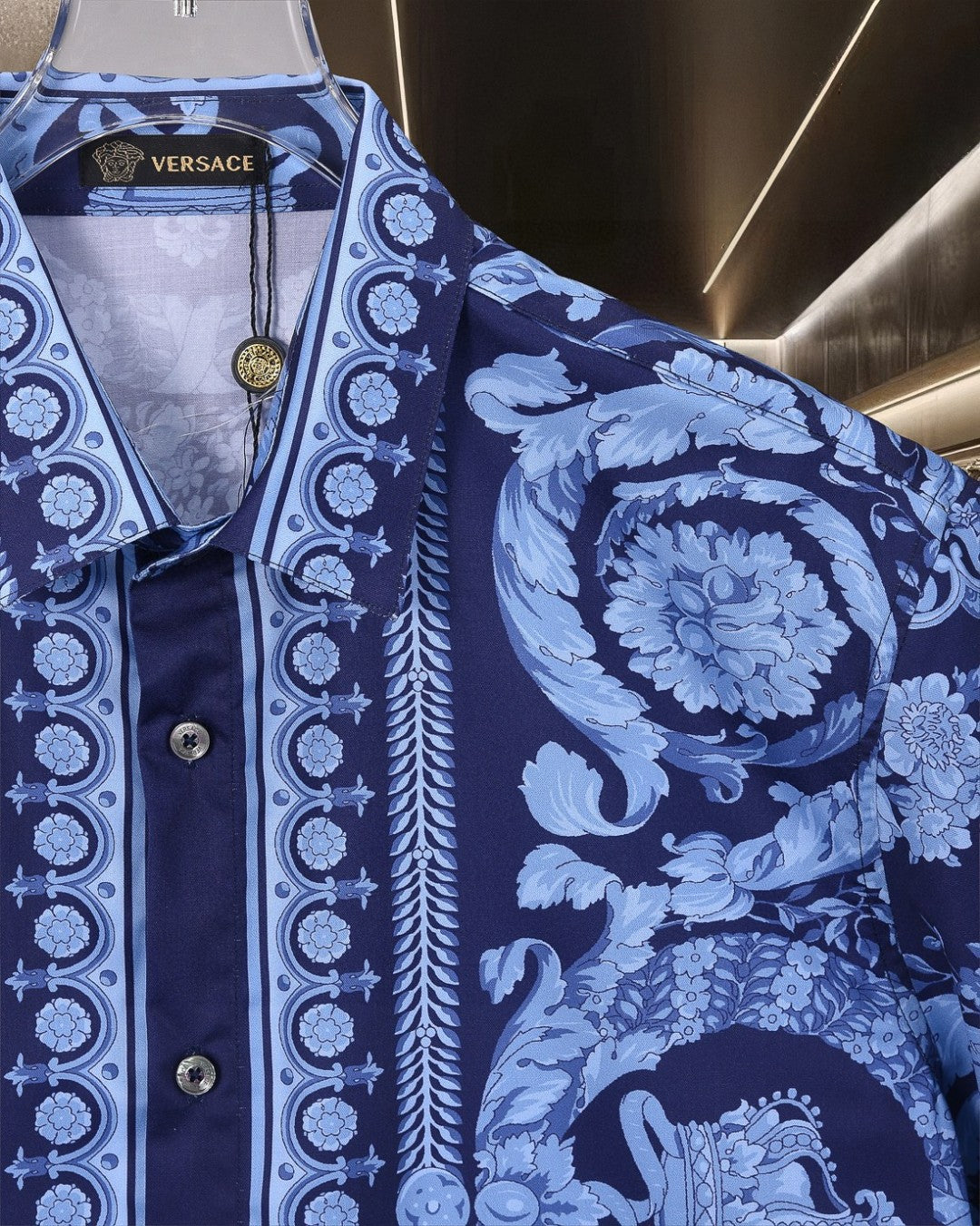 Blue printed shirt sleeve and placket with baroque medallion stripe and floral scrolls