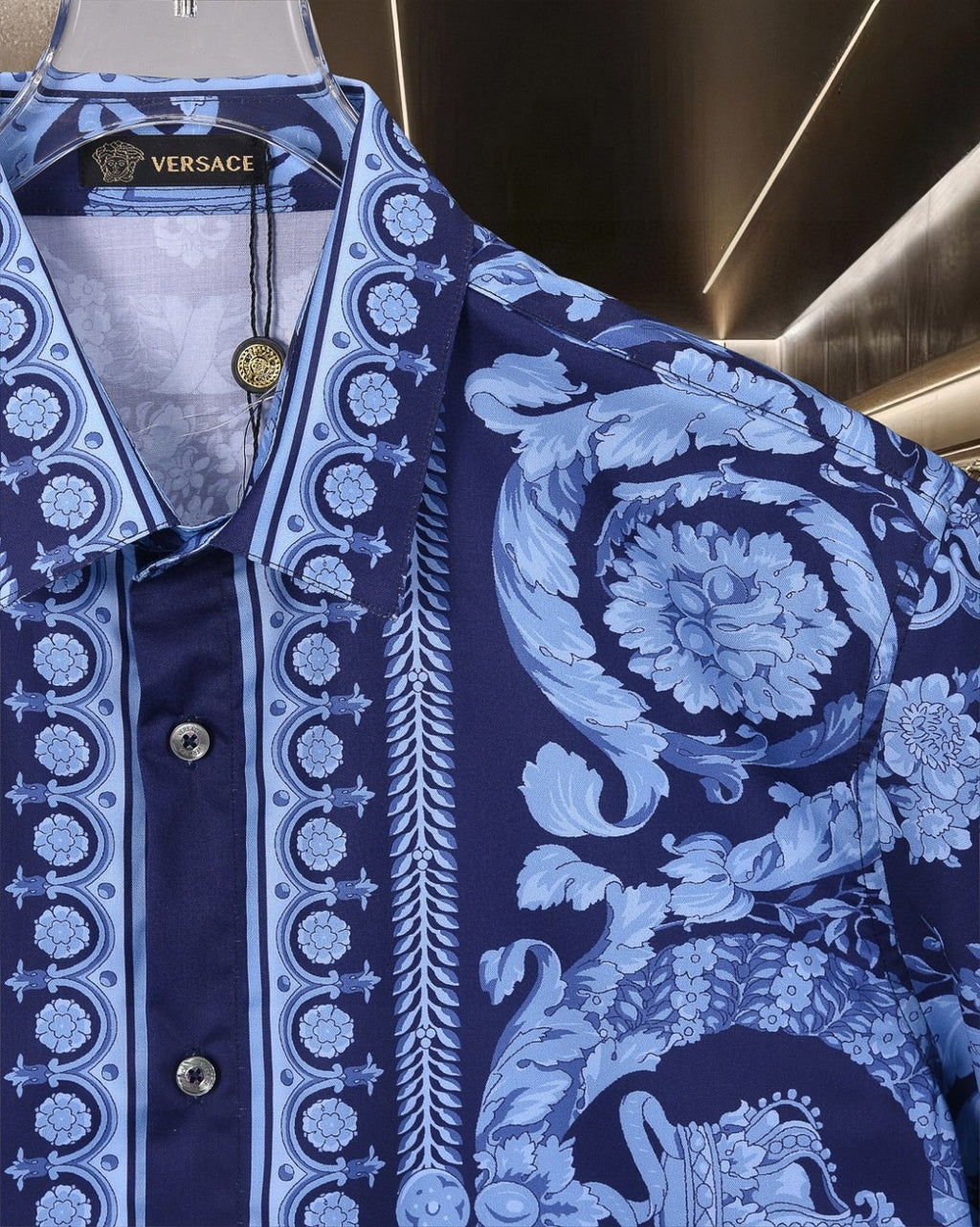 Versace blue short-sleeve shirt detail with baroque floral print and striped placket