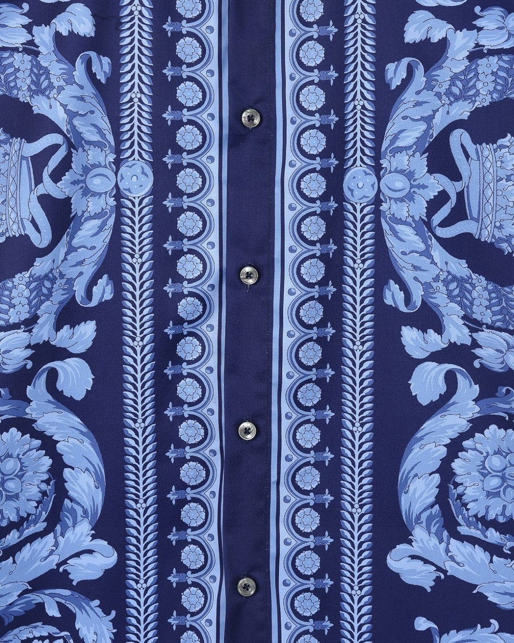 Blue short-sleeve shirt with vertical baroque stripe, floral motifs, and button row