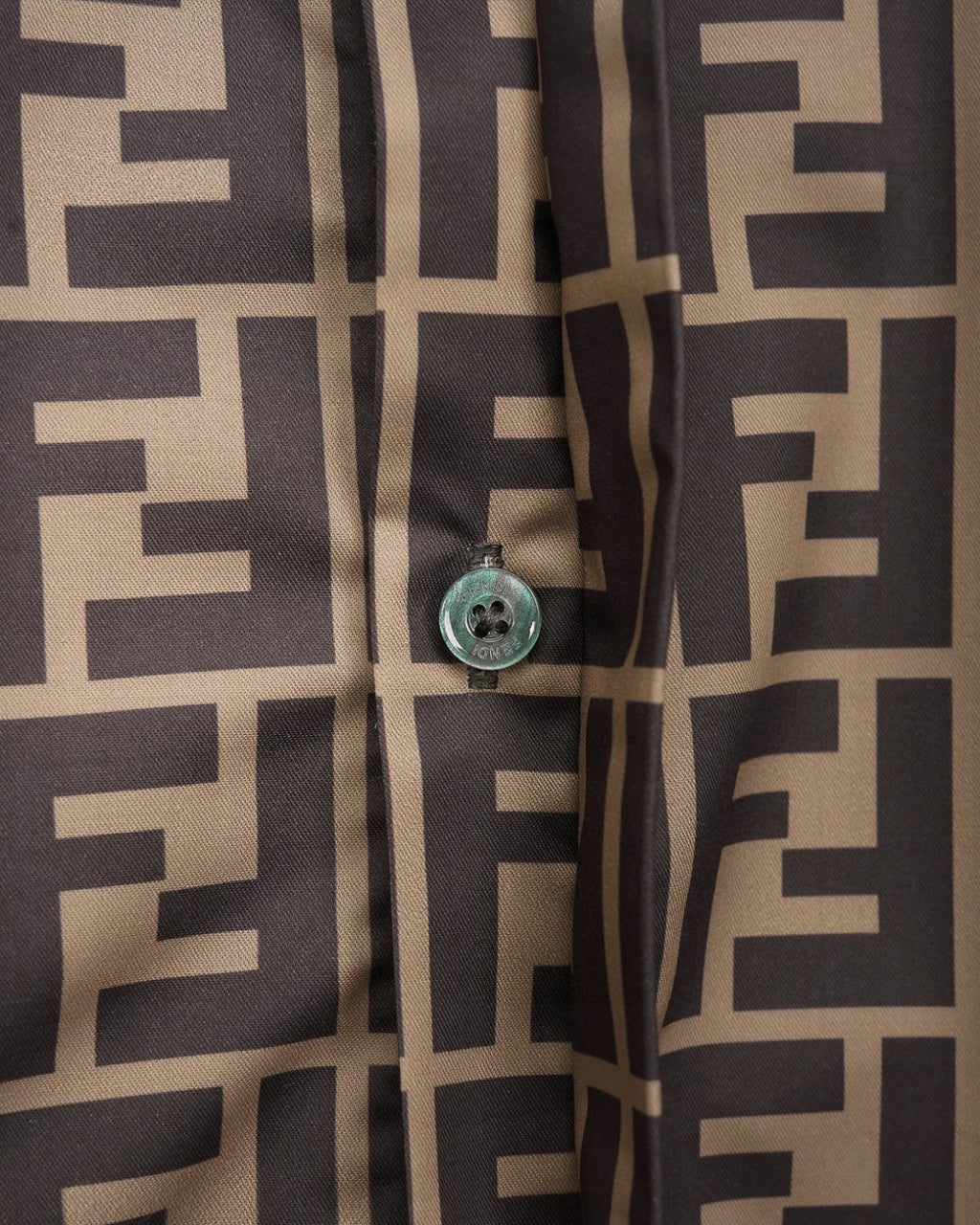 Fendi short-sleeve shirt cuff and button detail on FF logo pattern