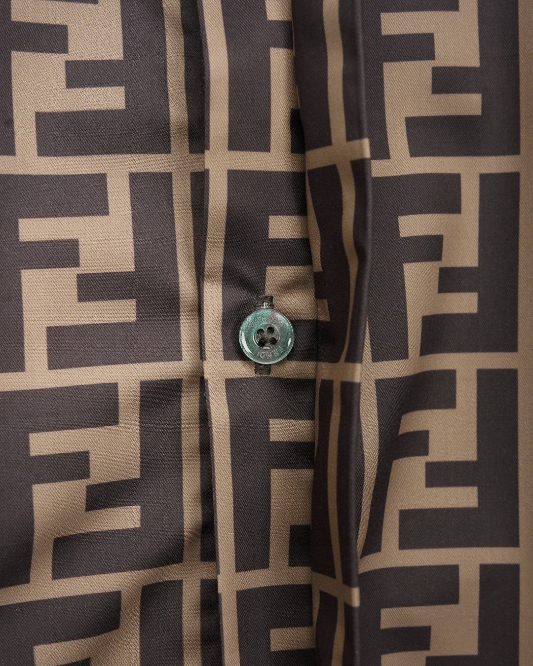 Fendi short-sleeve shirt cuff and button detail on FF logo pattern