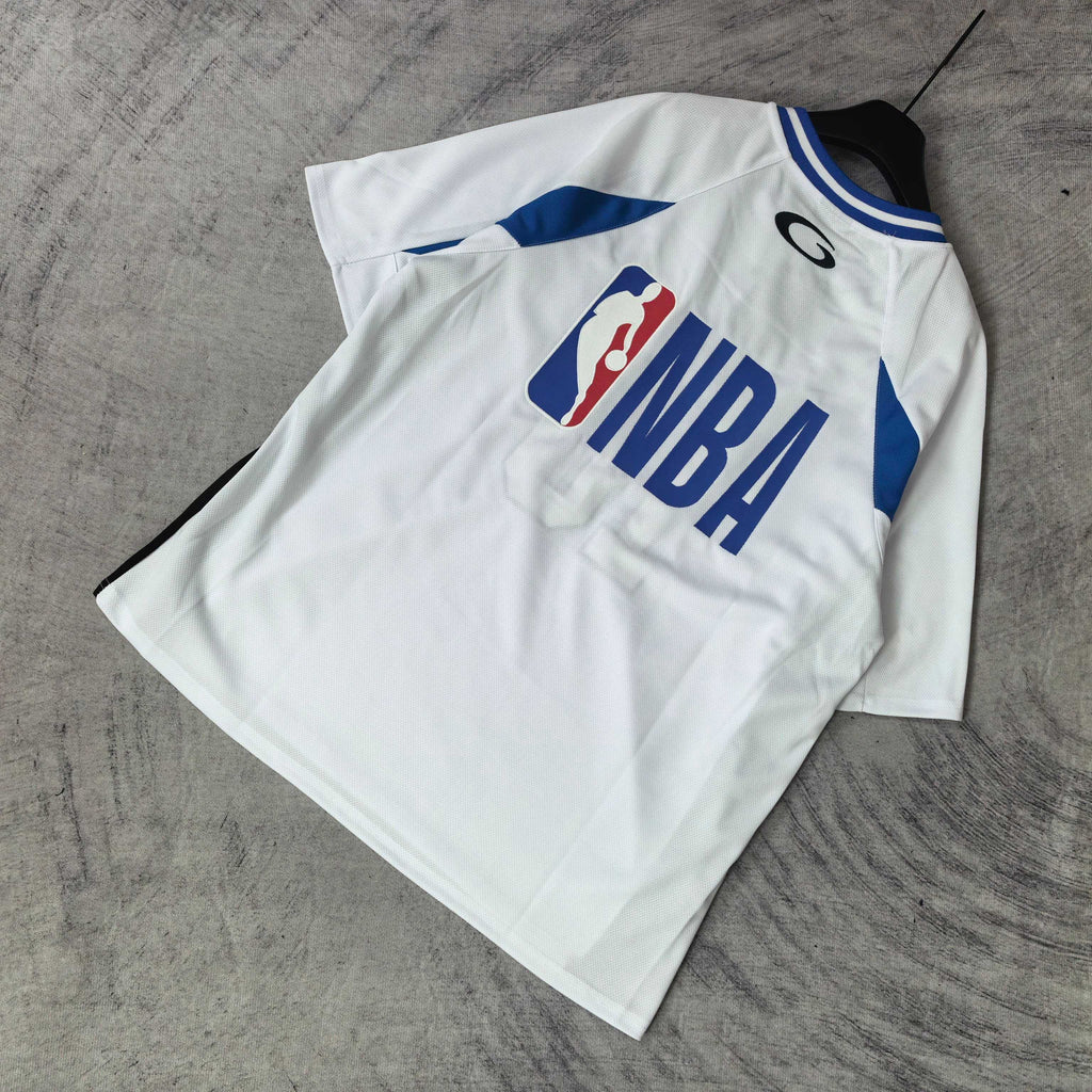 Balenciaga short-sleeve jersey laid flat, white with blue trim, “NBA” front graphic