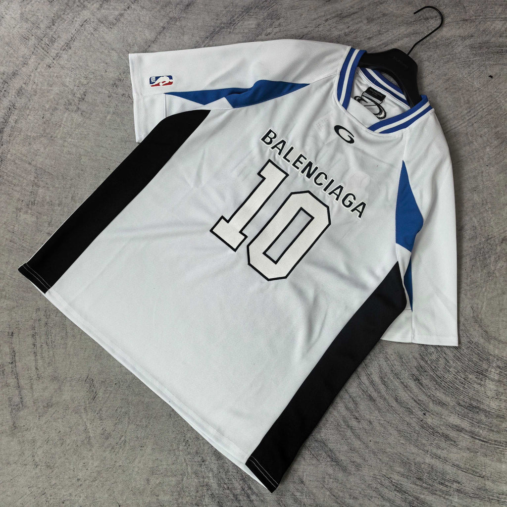 Balenciaga short-sleeve jersey laid flat, white with blue trim, “BALENCIAGA 10” front graphic