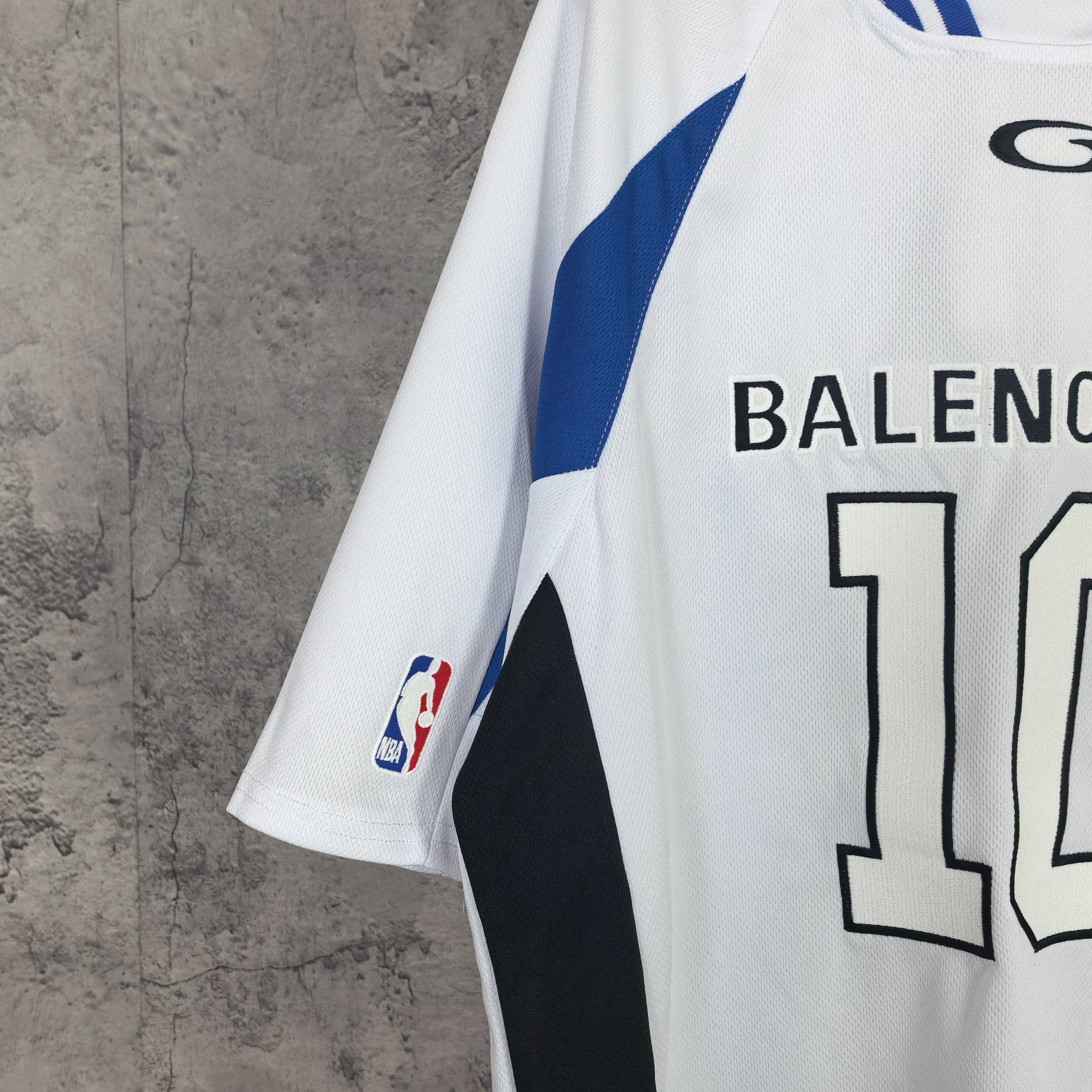 Balenciaga short-sleeve jersey close-up, blue sleeve stripe and partial “BALENCIAGA 10”