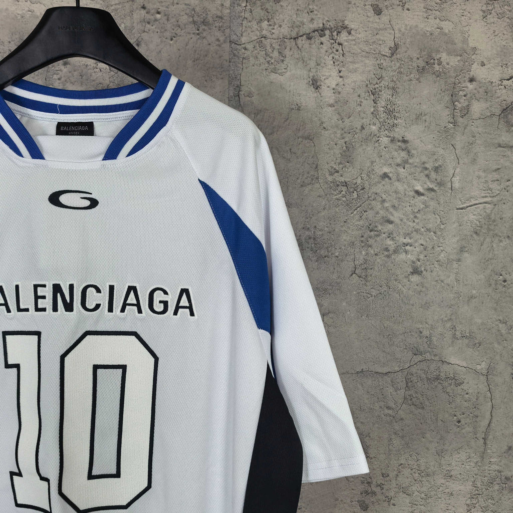 Balenciaga jersey top close-up with crew neck and BALENCIAGA 10 print, blue stripes