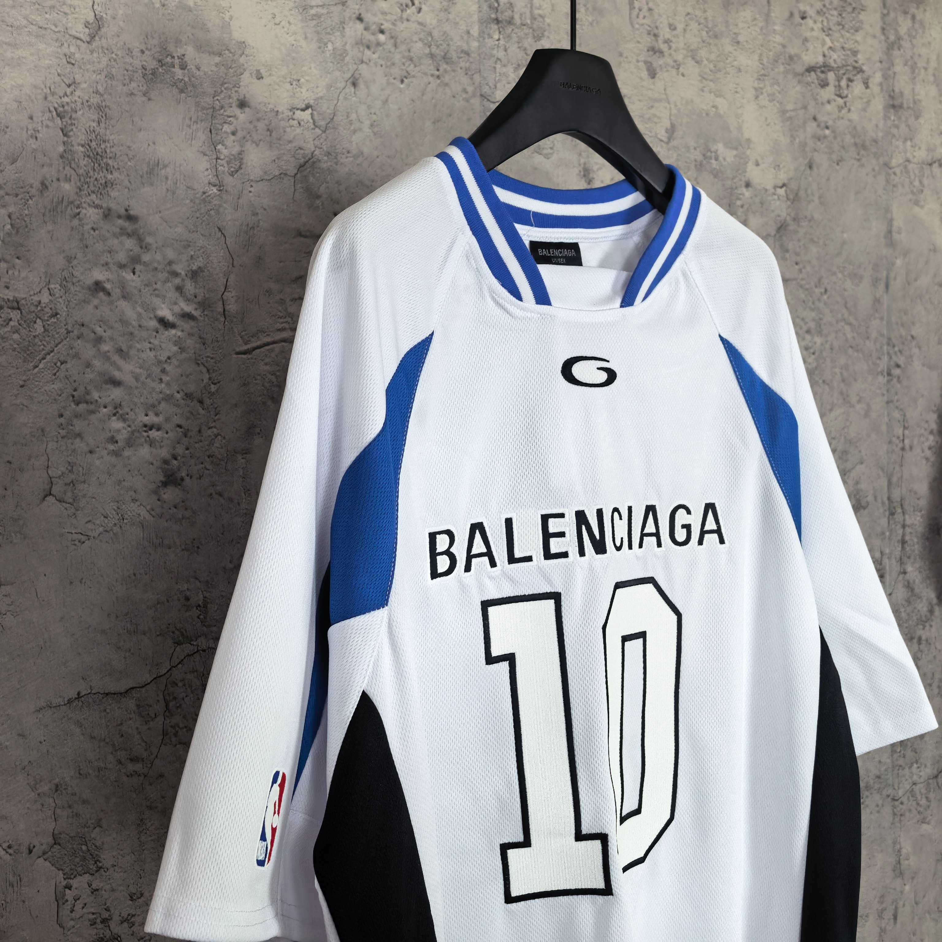 Balenciaga short-sleeve jersey, front view, white with blue trim, “BALENCIAGA 10” graphic