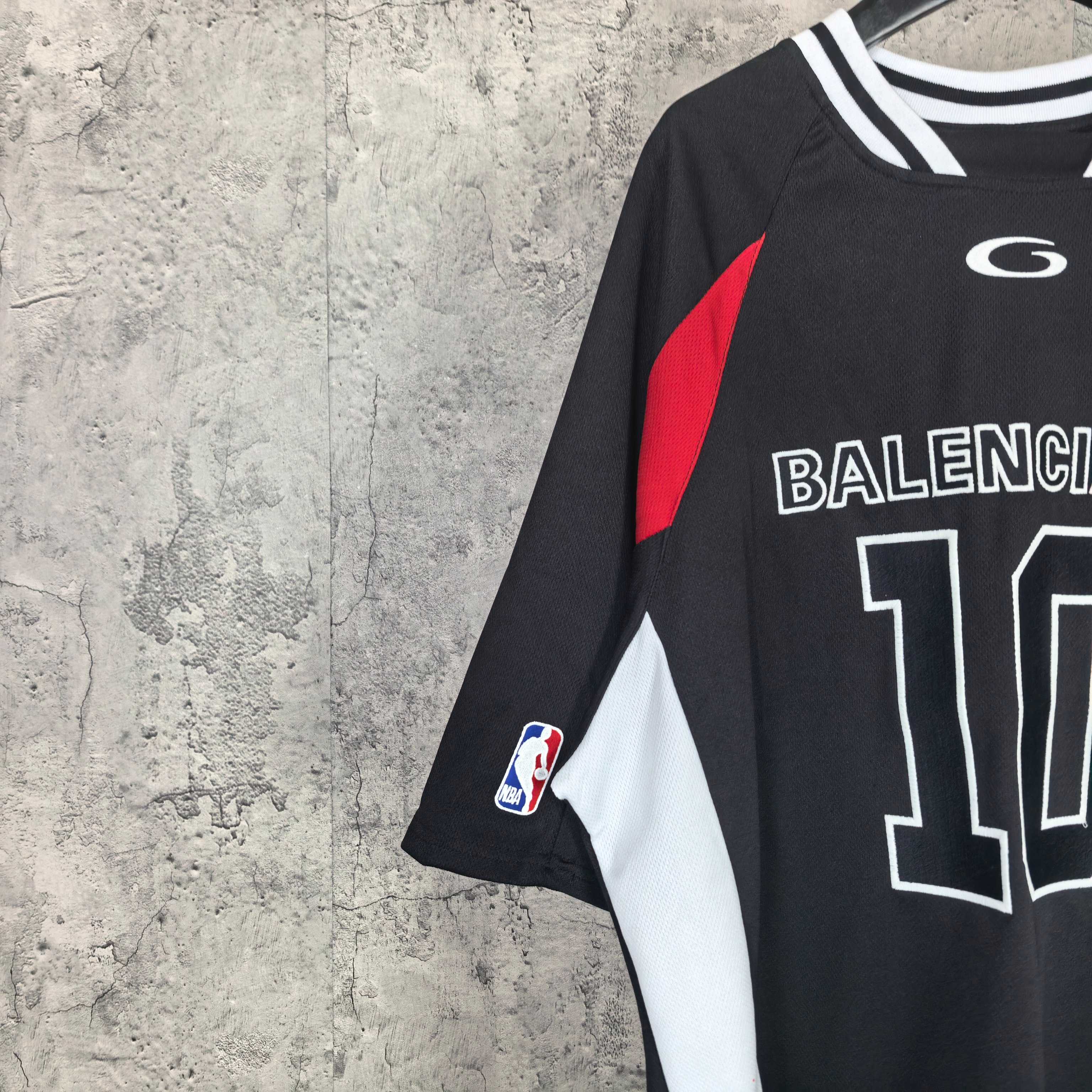 Black jersey side view with BALENCIAGA 10 print and white sleeve panel