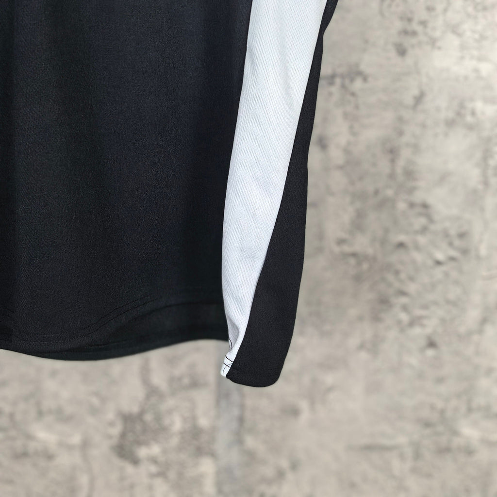 Balenciaga long-sleeve shirt with white side panel and curved hem