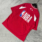 Red short-sleeve jersey laid flat with NBA back logo and white shoulder stripes