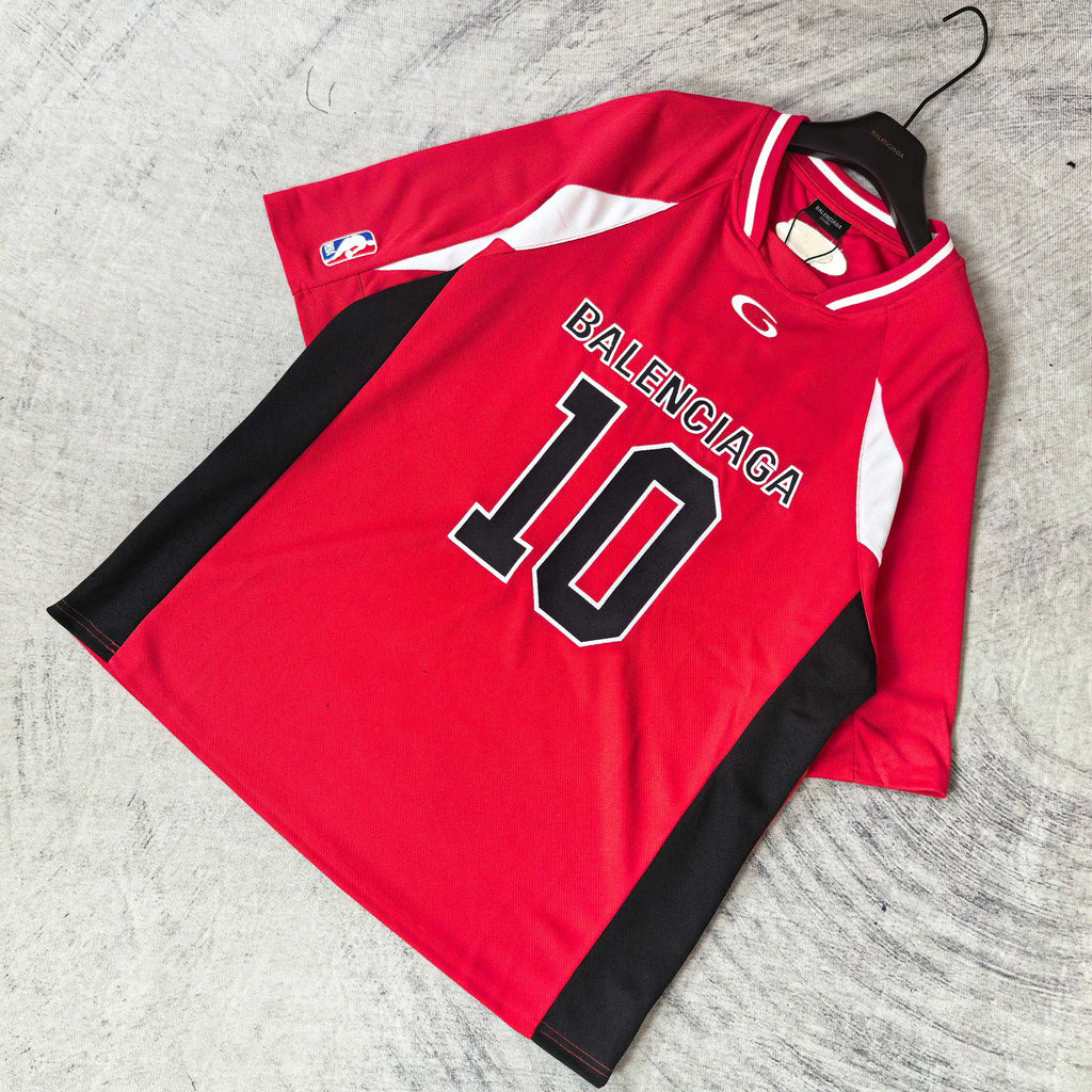 Red short-sleeve jersey laid flat with BALENCIAGA 10 front print and black side panels