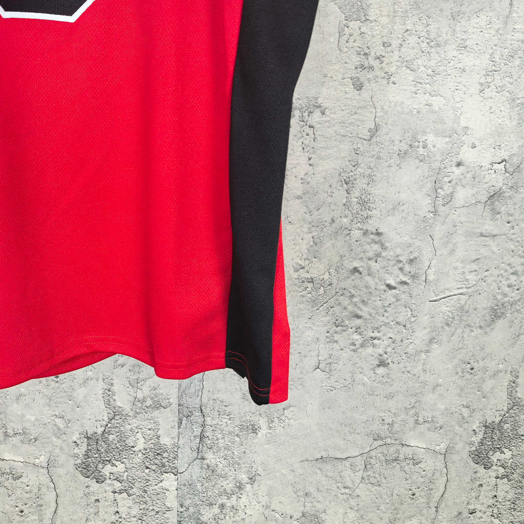 Short-sleeve shirt with red body and black side panels