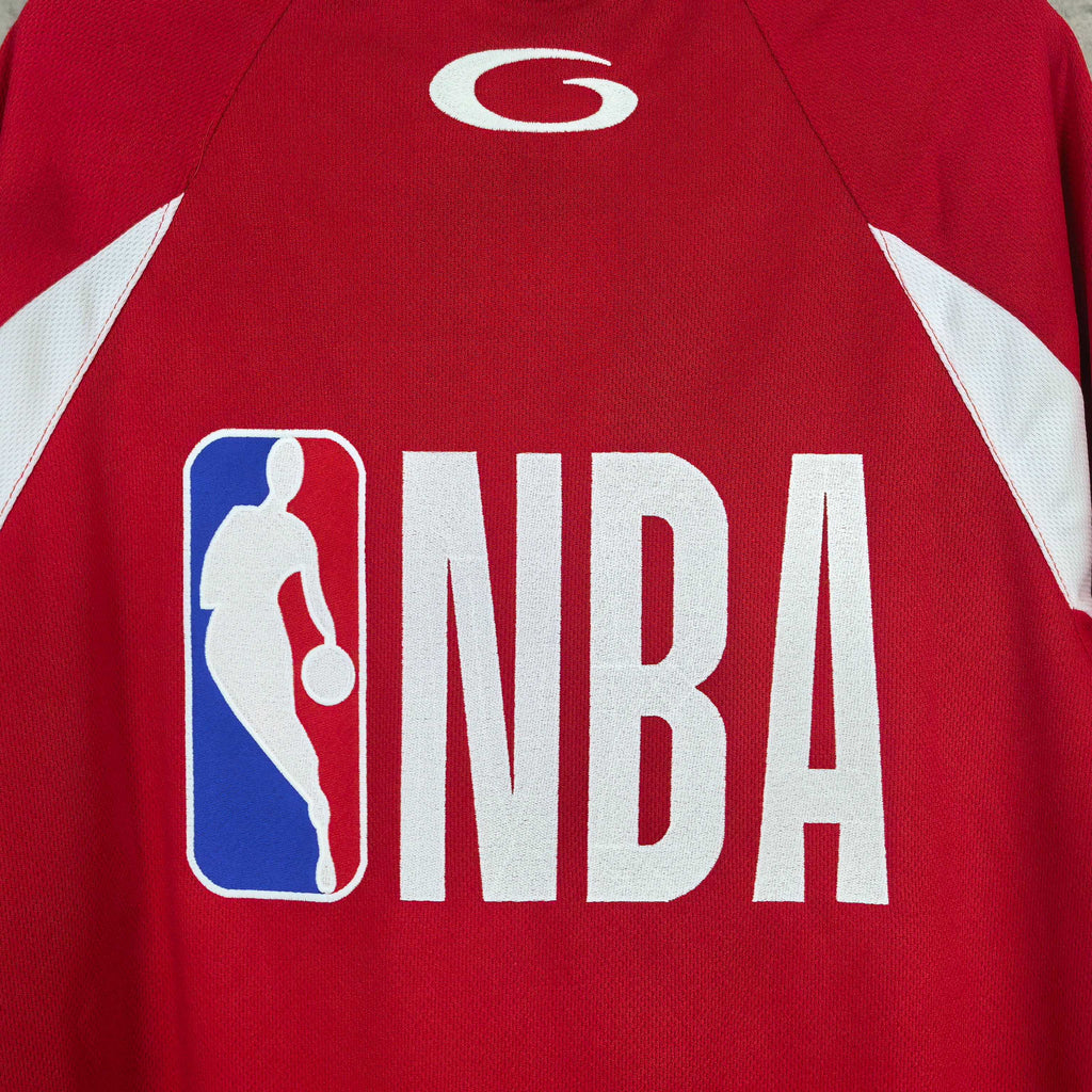 Close-up red jersey showing NBA logo wordmark and basketball icon