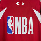 Close-up red jersey showing NBA logo wordmark and basketball icon