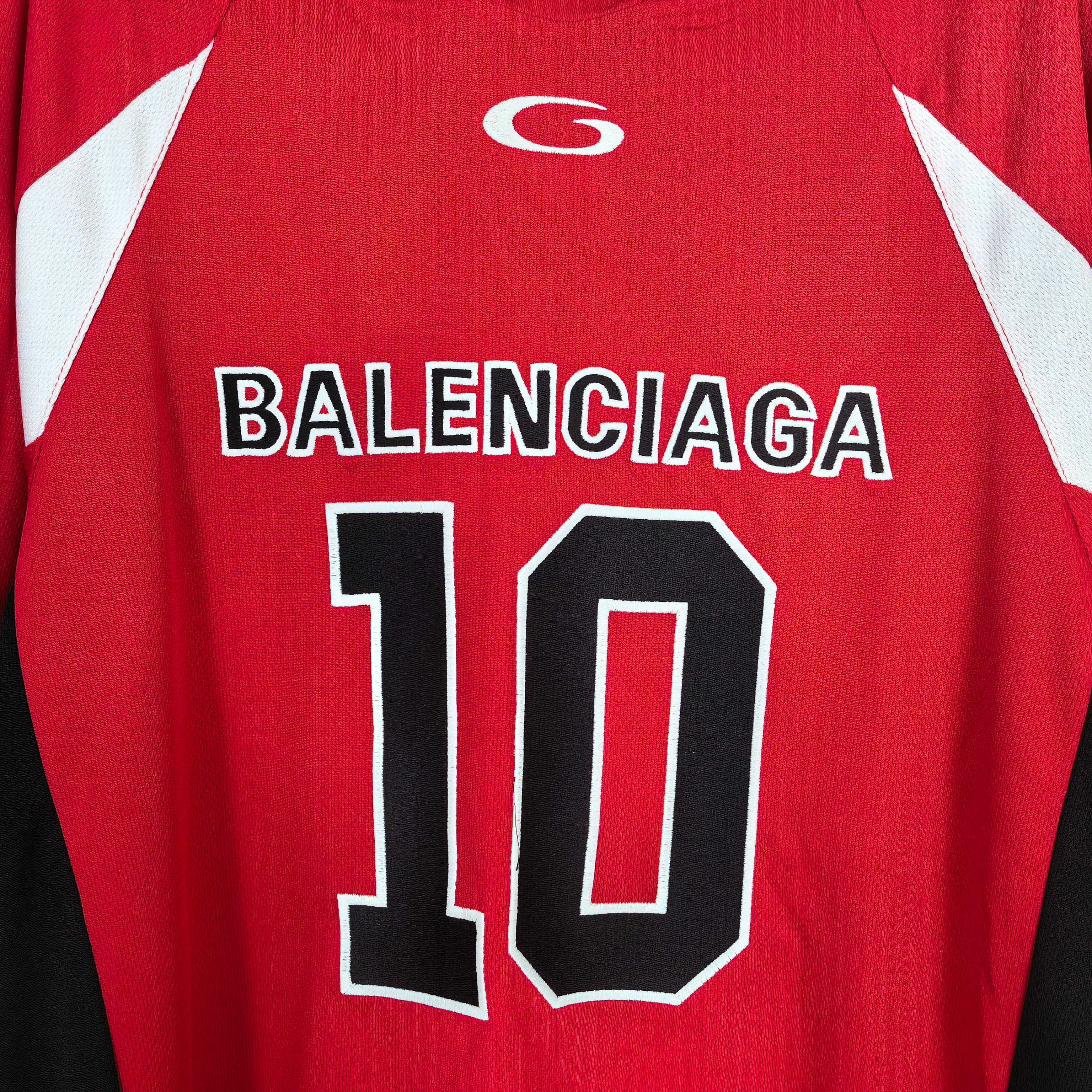 Close-up red jersey showing BALENCIAGA and large 10 front graphic