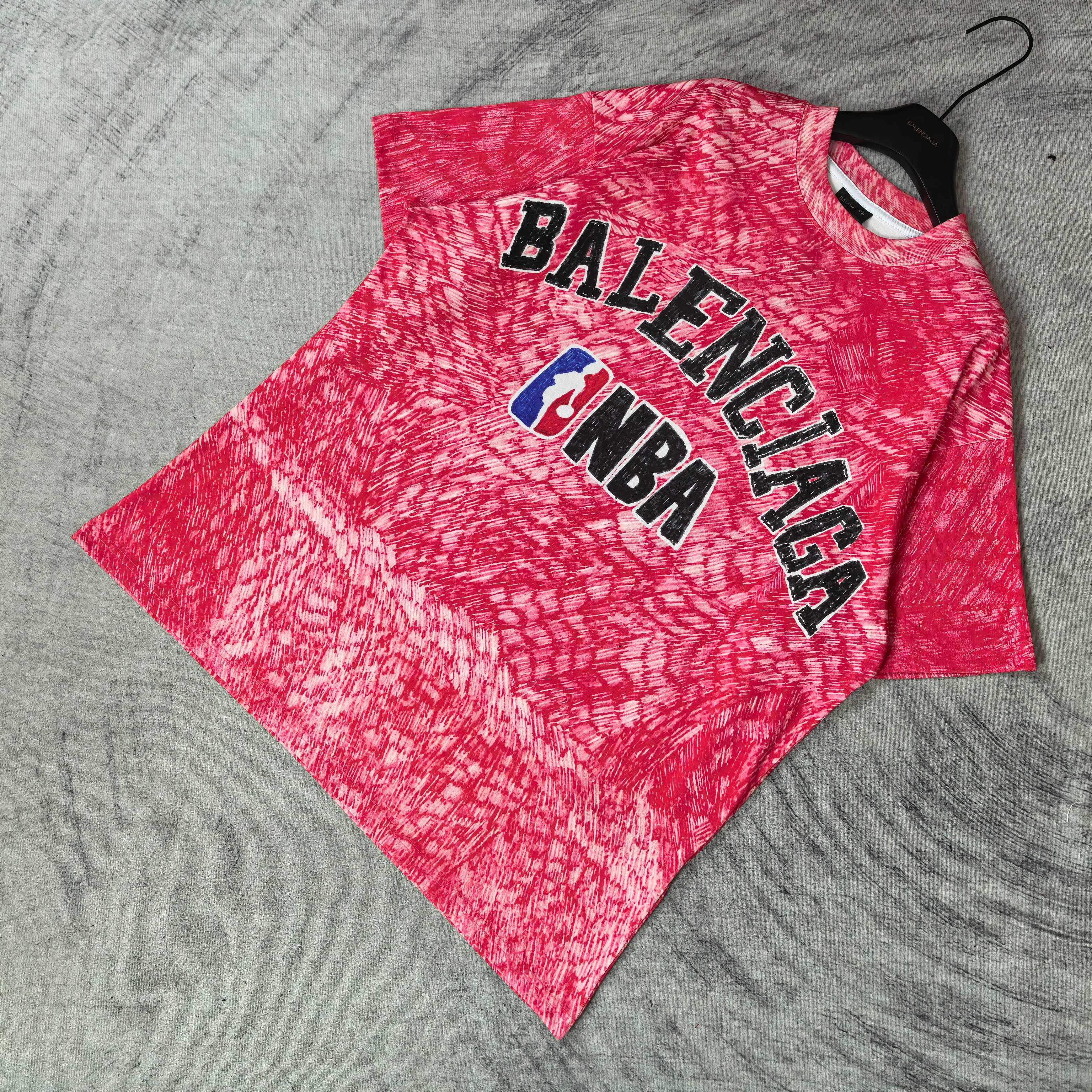 Balenciaga short-sleeve T-shirt, red heather with BALENCIAGA and NBA logo, laid flat