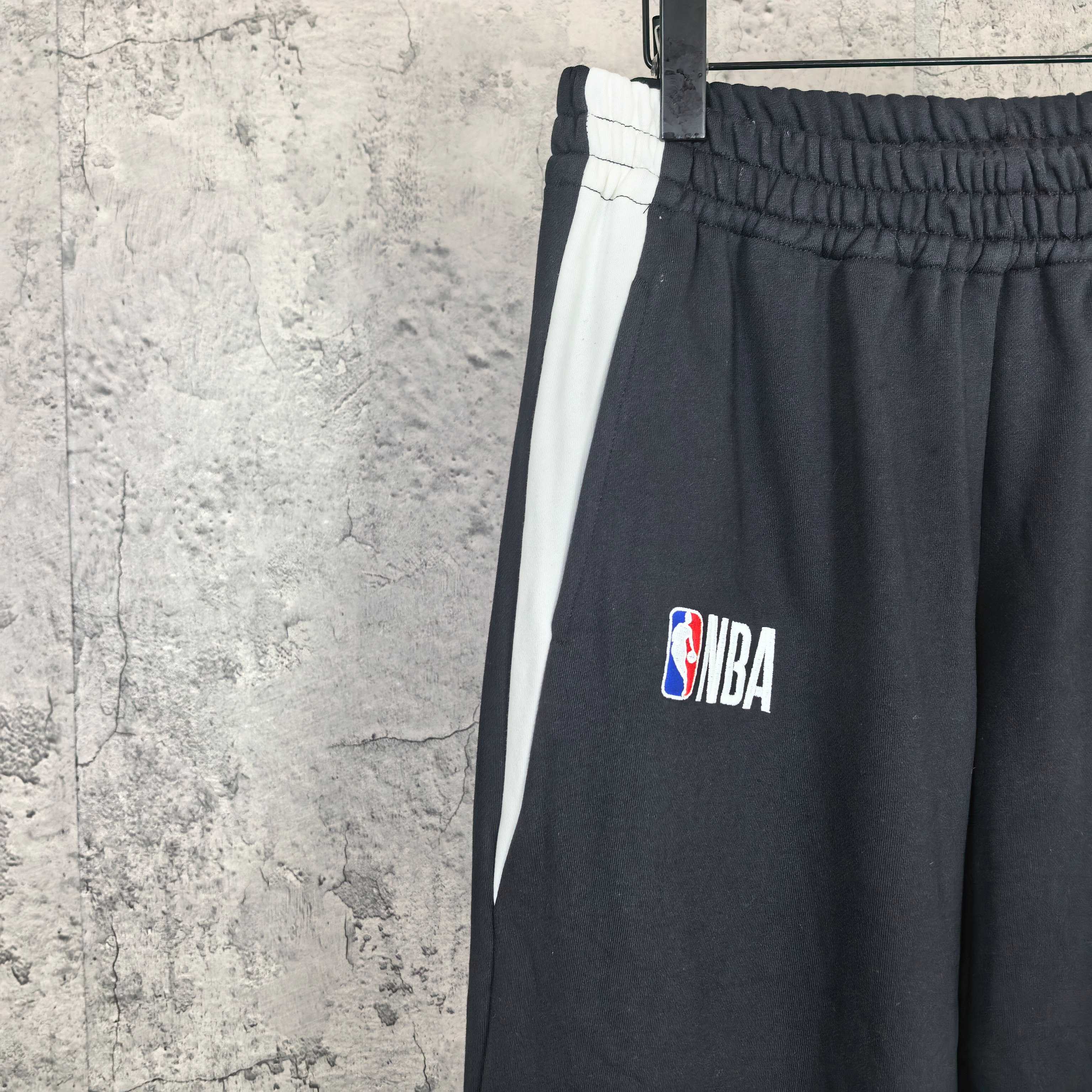 Black drawstring pants with NBA patch logo