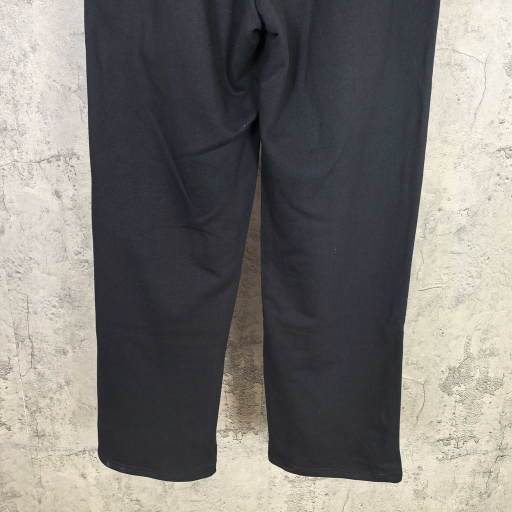 Dark wide-leg pants with curved seams