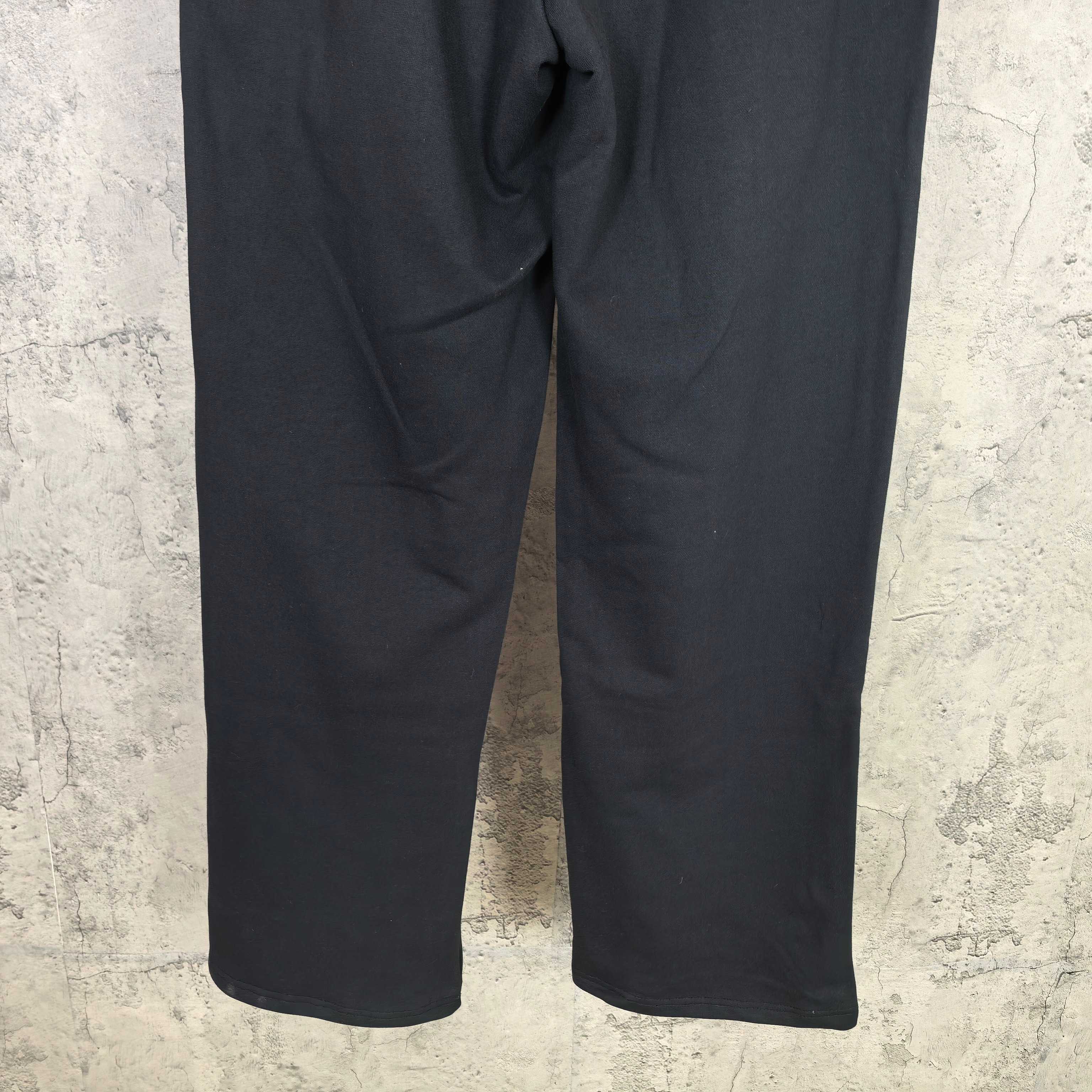 Dark wide-leg pants with curved seams