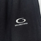 Balenciaga logo patch on black track pants