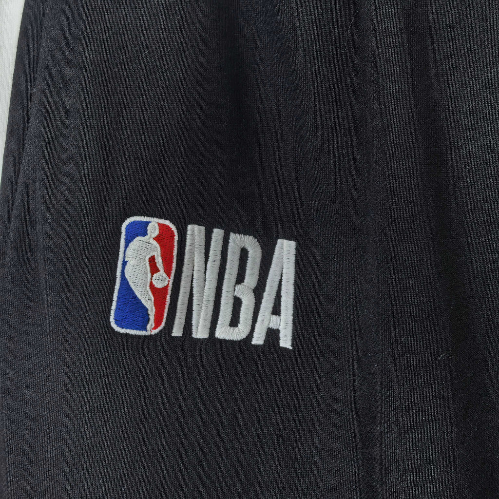 NBA logo on black track pants