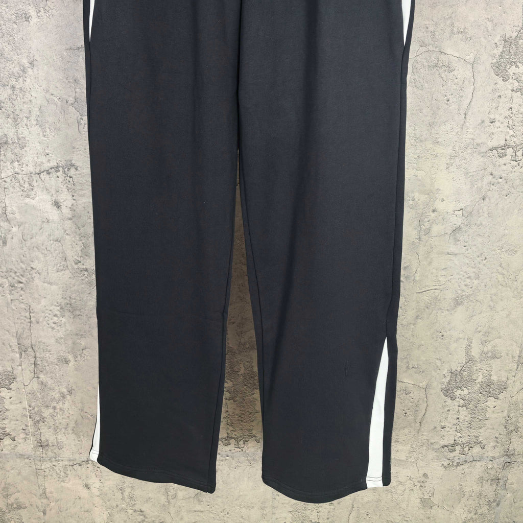 Dark wide-leg pants with white side stripes
