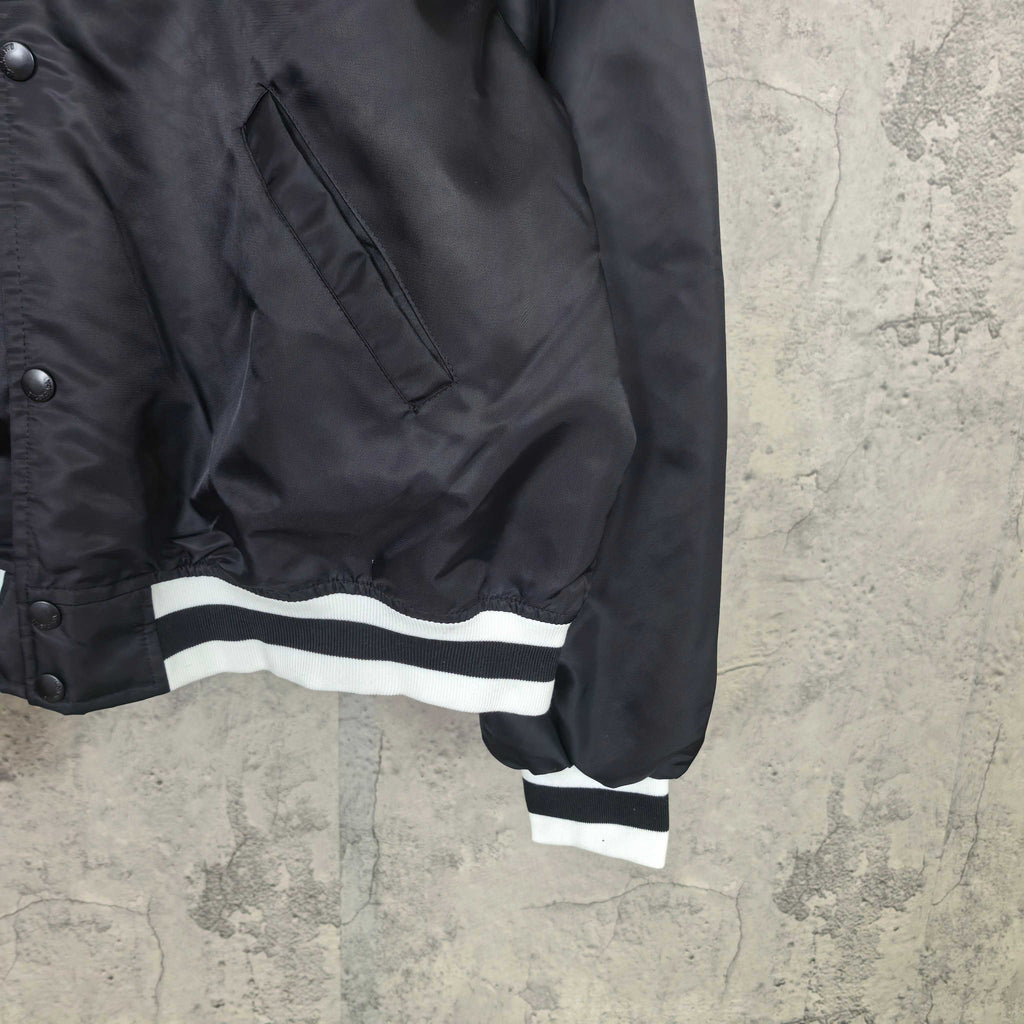 Balenciaga long jacket with striped cuff and button placket, black fabric
