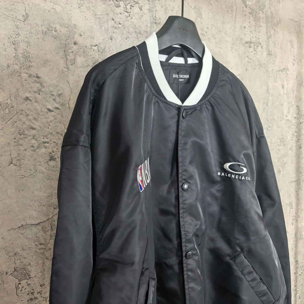 Black bomber jacket with NBA patch and Balenciaga logo patch on right chest