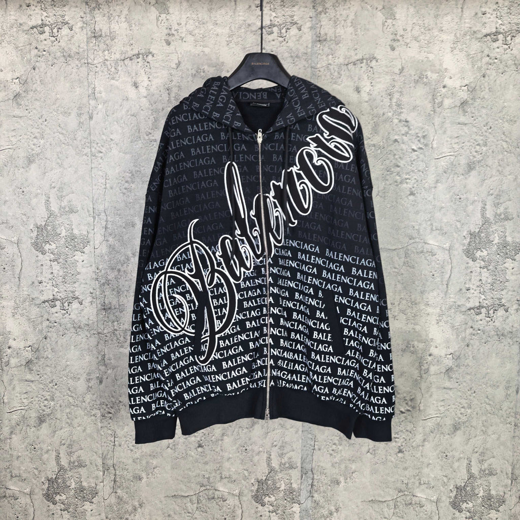 Long-sleeve zip hoodie in dark color, with allover Balenciaga text and graphic logo print.