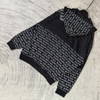 Balenciaga zip-up hoodie, black with hood and zipper; repeating text pattern and white logo